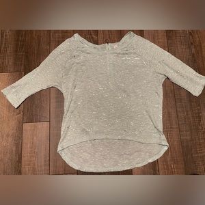 Teal sweater with quarter sleeves. The size is XL 14/16 plus size.